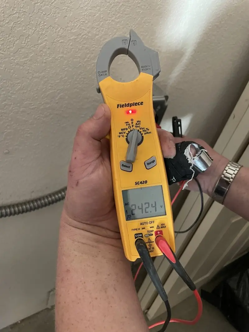 Voltage testing with clamp meter during Electrical Installation Services in Peterborough